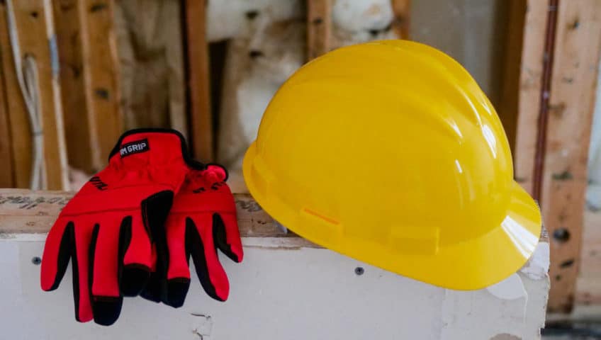 Hard had and gloves on construction site