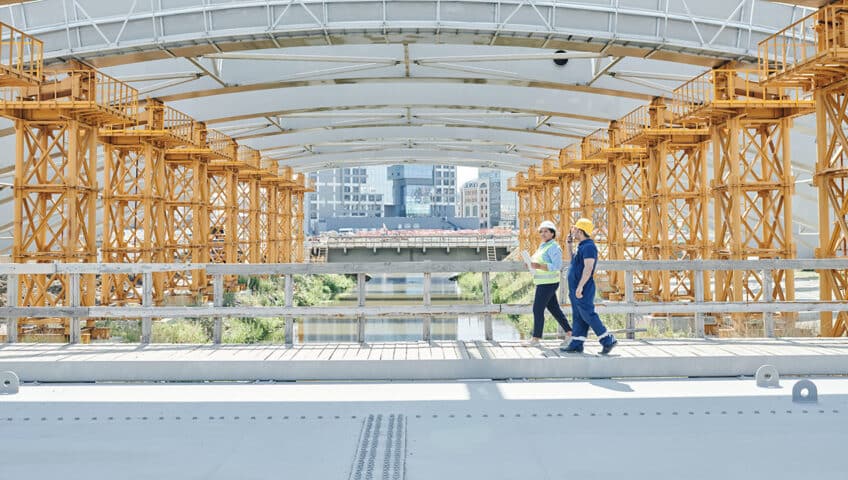 Construction workers walking on a job site